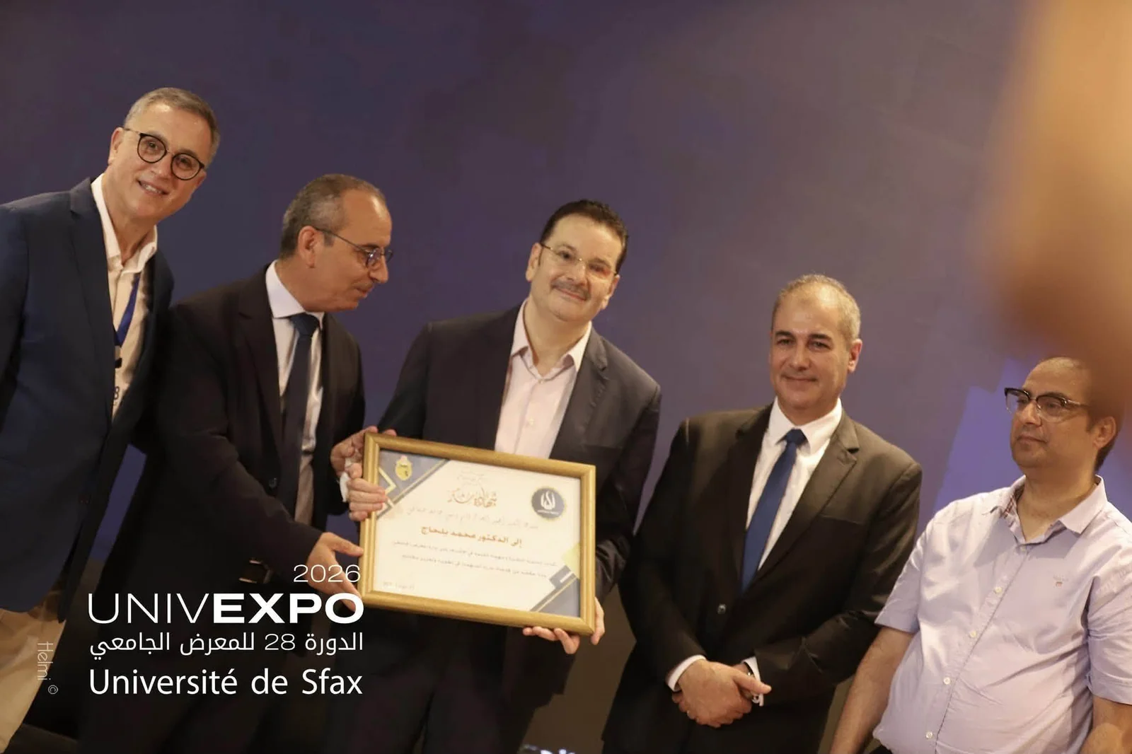 Dr Mohamed Belhaj receiving an institutional distinction at UNIVEXPO 2026, University of Sfax